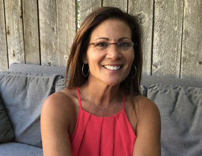 Woman wearing Visualites 2 half moon lightweight reading glasses