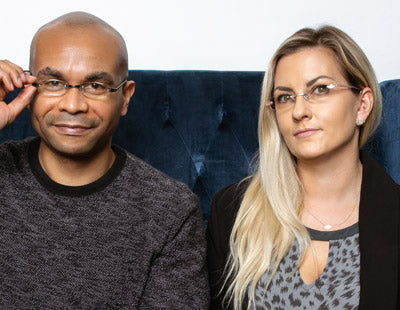 Man and woman wearing Visualites 5 oval shaped rimless readers