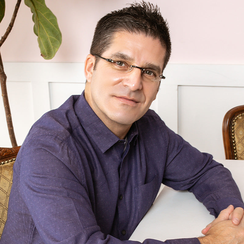 Man wearing Visualites 5 lightweight rimless reading glasses with oval lenses in black