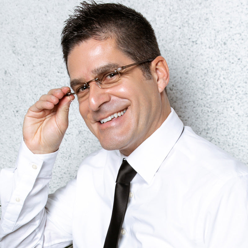 Man wearing Visualites 7 lightweight rimless readers for looking over the top