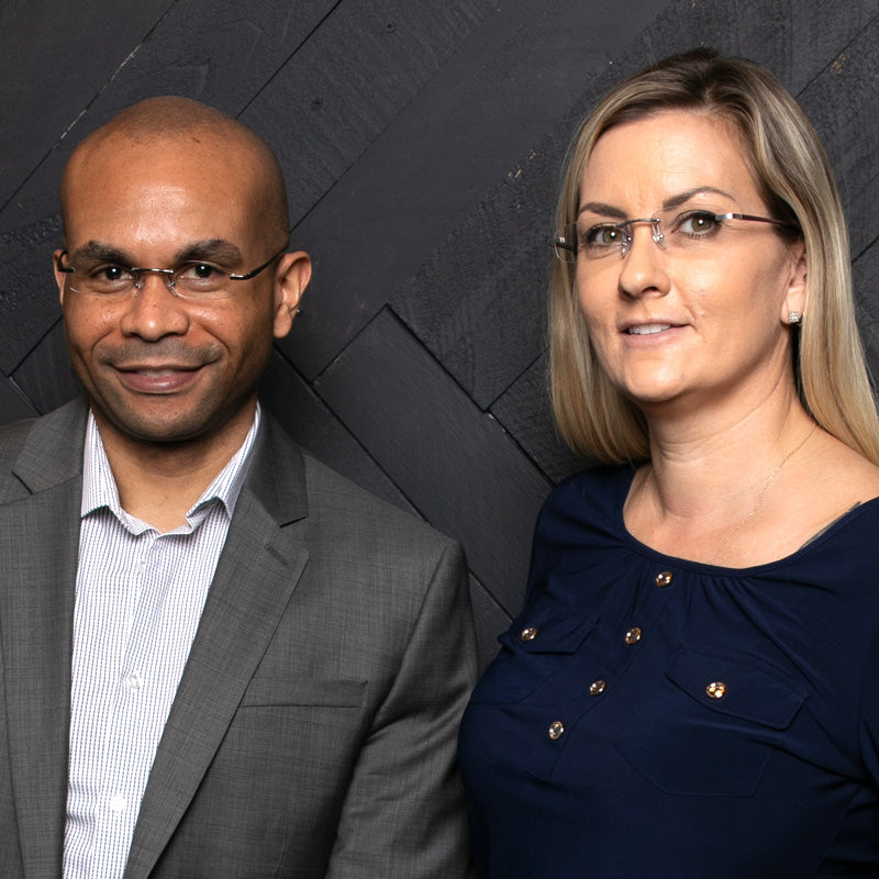 Man and woman wearing sleek rimless reading glasses with soft pillow shape lenses