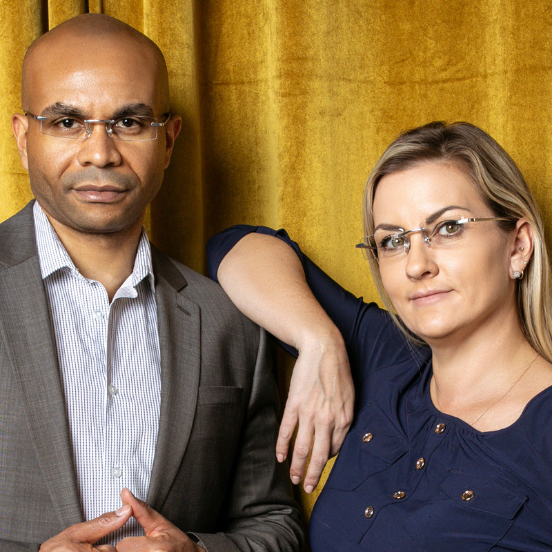 Man and woman wearing metal rimless modern reading glasses