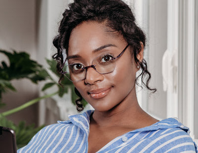 Woman wearing black stylish reading glasses