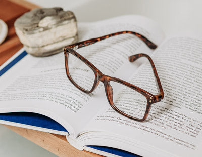Visualites Beau quality designer tortoise reading glasses sitting on a book