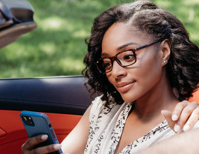 Woman wearing tortoise shell designer reading glasses made with optical quality lenses