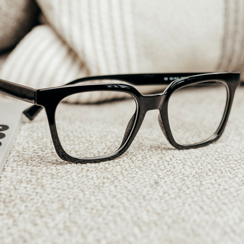 Visualites Réveur Black Designer Progressive Reading Glasses Sitting On A Couch
