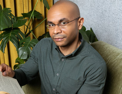 Man wearing sleek and lightweight half moon reading glasses