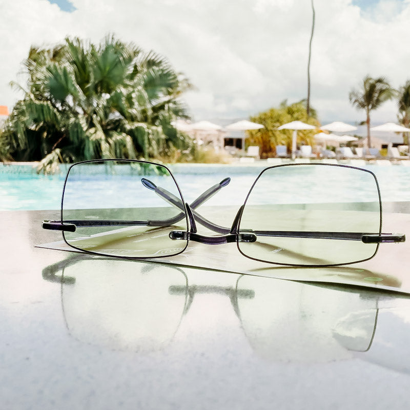Visualites Esprit Rimless Progressive Reading Glasses On A Table By The Pool